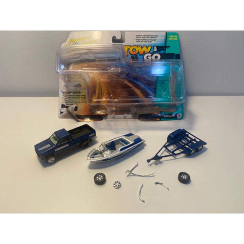 DAMAGED OPEN BOX AS-IS 1/64 Johnny Lightning 1985 Toyota SR5 Pickup with Malibu Speed Boat Trailer (Blue) Diecast Models